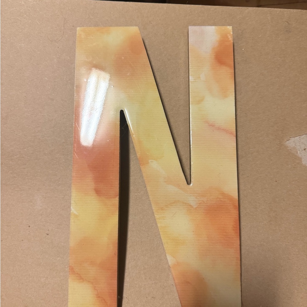 Orange and Yellow Decorative Letter 'N'